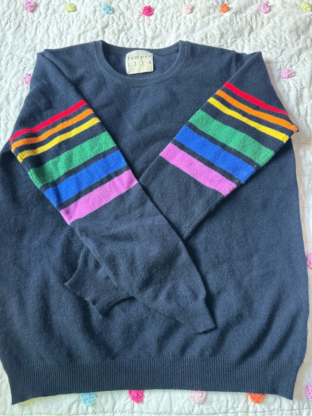 Jumper 1234 Women’s Navy Crewneck Sweater with Rainbow Stripe Sleeves. Size “3”